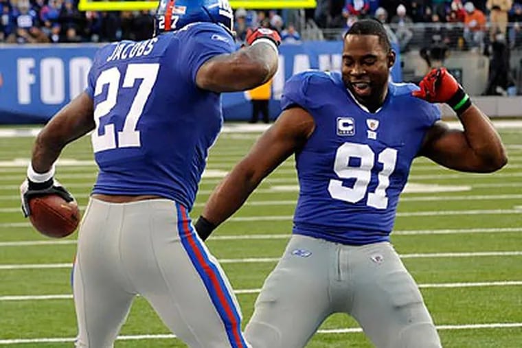 The Giants are flying high after yesterday's 31-7 rout of Washington. (Bill Kostroun/AP)