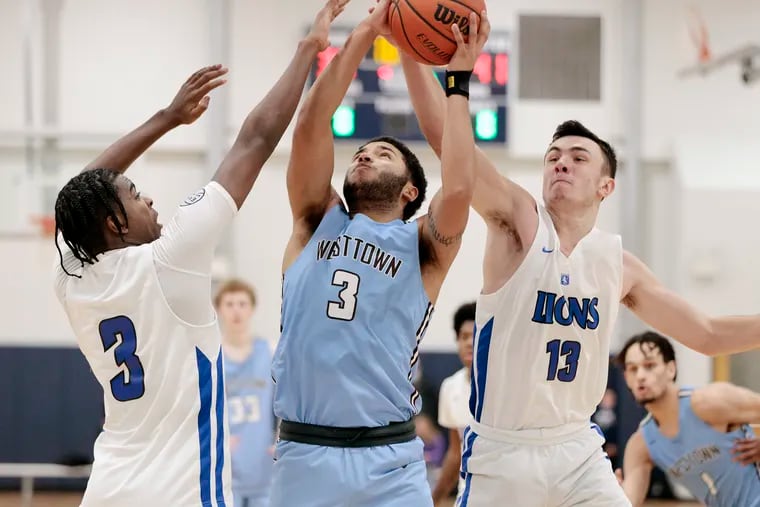 Phelps' Chas Kelley (3) and Jack Collins trying to block a shot by Westtown’s Quin Berger during their game on Feb. 12.