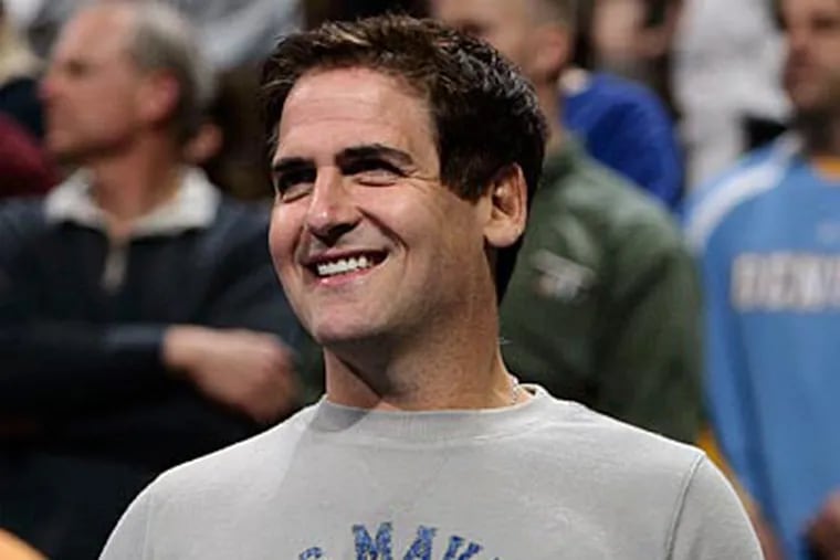 Mavericks owner Mark Cuban is trying to replace the BCS system with a playoff system. (AP Photo/David Zalubowski)