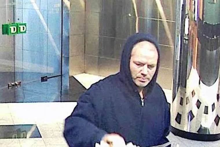 A bank robber believed to have struck three Frankford Avenue branches earlier in the year hit a Center City bank April 6, 2013. (FBI)