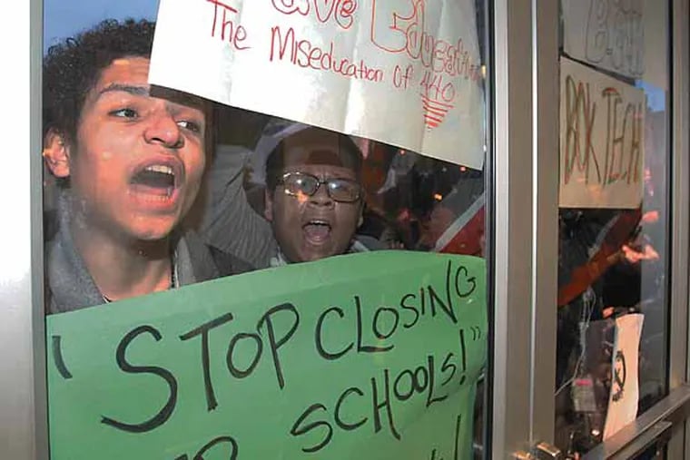 About 100 students, parents, and organizers found themselves temporarily locked out of the School District of Philadelphia Building after marching from City Hall. They were eventually allowed to come in.  Students, like Joshua Garcia, Jr., left, of Charles Carroll High School, wanted to tell the School Reform Commission exactly what they think about Superintendent Bill Hite's plan to close 37 schools and close or change programs at dozens others.    ( Charles Fox / Staff Photographer )