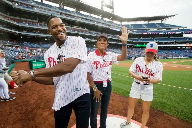 Good Morning America hosts, L-R: Michael Strahan, Robin Roberts, and Ginger Zee took to the field before the game between the Phillies and the Diamondbacks at Citizens Bank Park on June 12, 2019.