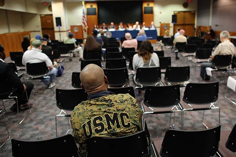 U.S. Army and United States Marine Corp veteran William H. Thompas, wearing his U.S.M.C. jacket, listens from his seat in the audience during a town hall forum hosted by the Philadelphia's Veterans Affairs benefit office, Saturday, May 9, 2015, in Philadelphia. ( Joseph Kaczmarek / For The Inquirer )