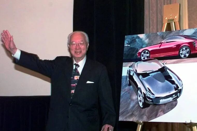 File: Yutaka Katayama, the "father of the Z" waves to the media after introducing Nissan's new Z car concept during a news conference in Dearborn, Mich. Katayama, who built the Z sportscar into a powerful global brand in the 1970s, died Thursday, Feb. 19, 2015, his son said. He was 105. (AP Photo/Carlos Osorio, File)