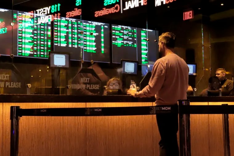 A customer makes a sports bet at the Borgata casino in Atlantic City N.J. on March 17, 2022 just before the March Madness college basketball tournament began. On March 24, 2022, a New Jersey state Senate committee advanced a bill that would give Atlantic City money from a 1.25% tax on sports betting revenue made by casinos and tracks, to be used for local tax relief. (AP Photo/Wayne Parry)