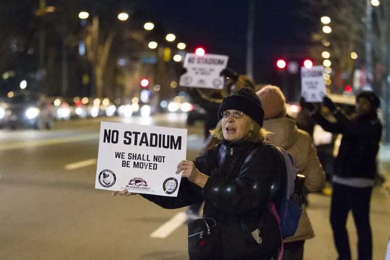 Prior to the March 6th meeting, opponents of Temple’s proposed football stadium stood along N. Broad Street.