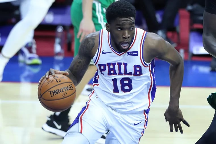 Shake Milton, left, of the SIxers drives against the Celtics during the 2nd half of a NBA preseason game at the Wells Fargo Center on Dec. 15, 2020.