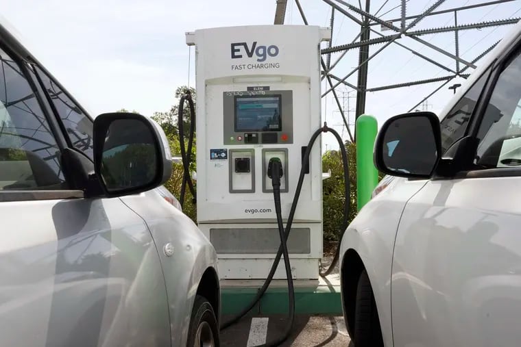 Electric cars are parked at a charging station in Sacramento, Calif., in April.