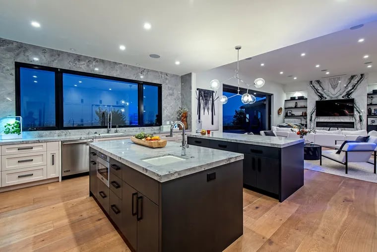 This multimillion-dollar California home highlights luxury style trends featured in Coldwell Banker's "Best of the Best" guide for wealthy homeowners, including a kitchen with two islands and pocket walls that blend indoor-outdoor spaces.