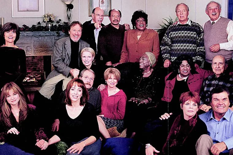Norman Lear with actors from some of his hit TV shows.