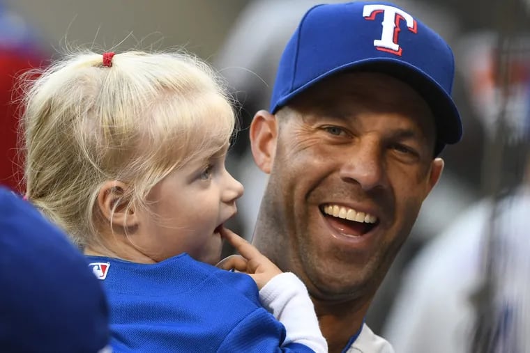 Josh Bonifay and his daughter Cora during his 2017 season with the Rangers.