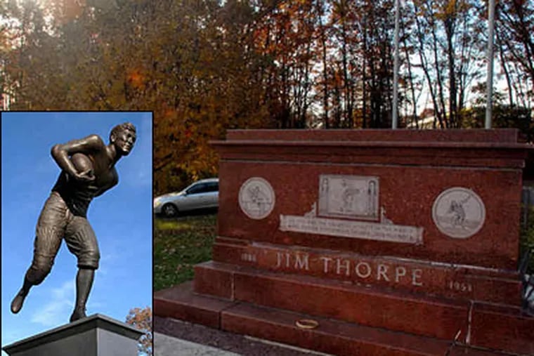 The monument (inset) and tomb of Jim Thorpe in the town that took the great athlete's name. &quot;Dad's soul will never be at peace,&quot; saida son, &quot;until his body is laid to rest . . . in his home&quot; in Oklahoma. (Tom Gralish / Staff)