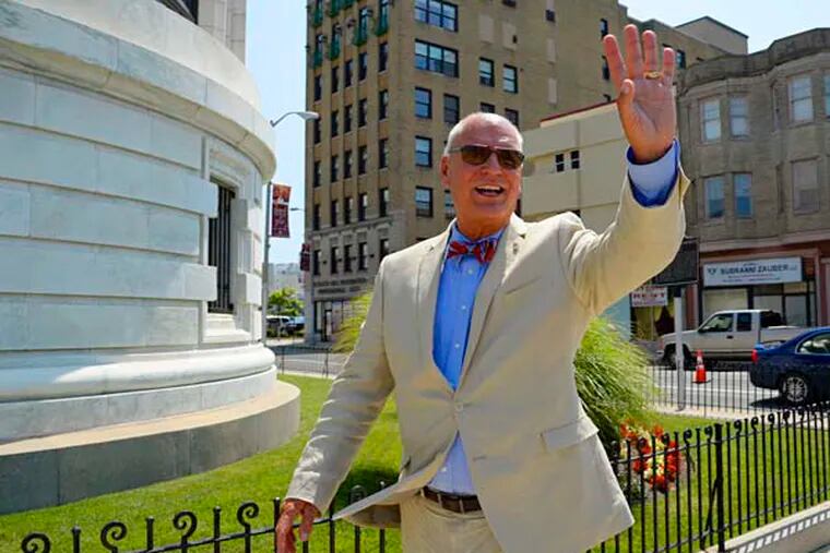Don Guardian, the 61-year-old mayor of Atlantic City, waves to a passing driver July 23, 2014 as he walks to a meeting in downtown AC.  ( CLEM MURRAY / Staff Photographer )