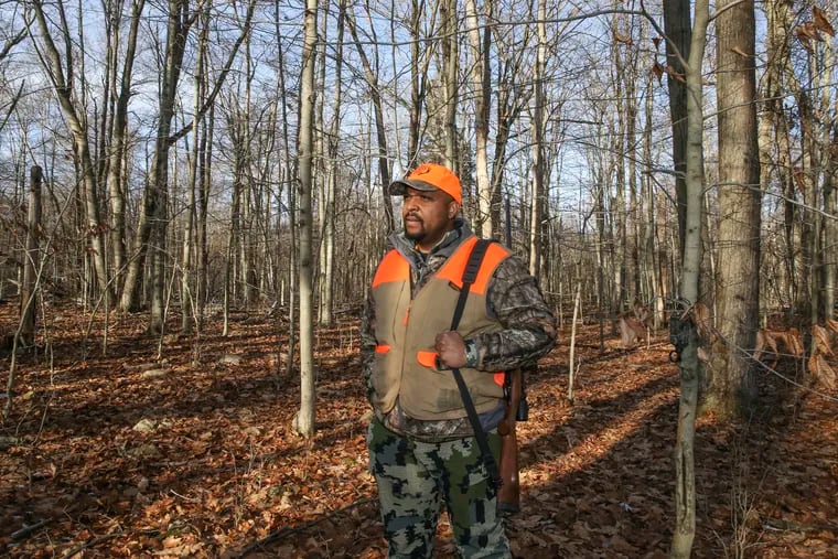 Jonathan Wright, who owns a hunting camp called Pocono Browns, is one of a small number of hunters of color in the United States. As the number of registered hunters has declined, he and others are hoping to diversify and grow one of America's favorite hobbies. He is shown here in the Pennsylvania State Game Lands behind his Pocono Summit cabin in Monroe County. Thursday, December 3, 2020