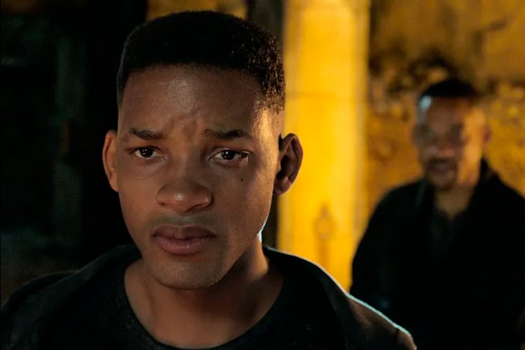 This image released by Paramount Pictures shows Will Smith, portraying Junior, foreground, and Henry Brogan in the Ang Lee film "Gemini Man." (Paramount Pictures via AP)