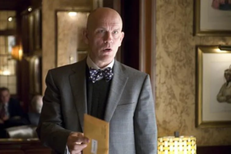 John Malkovich stars as a career CIA analyst in Joel and Ethan Coen&#0039;s dark spy-comedy &quot;Burn After Reading,&quot; which opened in theaters on Friday.