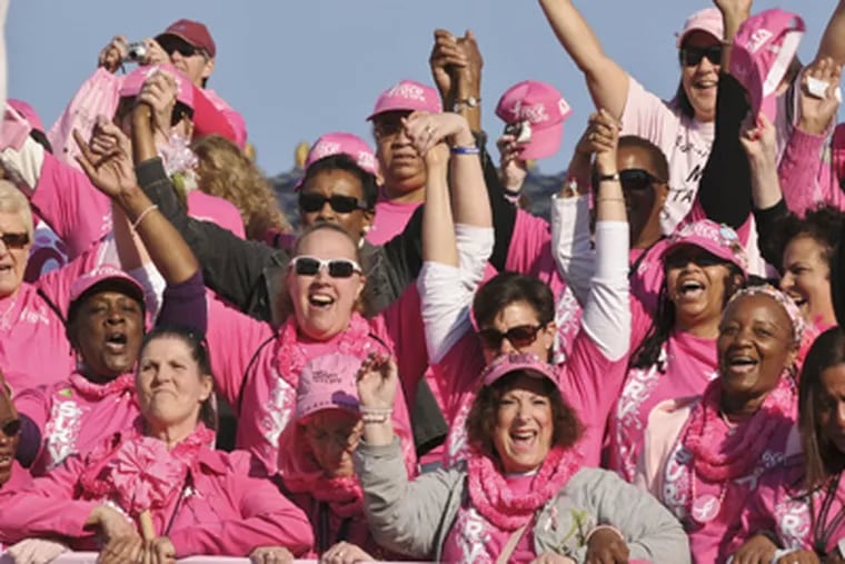 Some of the thousands of breast cancer survivors during the "March of Survivors" down the Art Museum steps at the start of the Susan G. Komen Race for the Cure. (Ron Tarver / Staff Photographer)