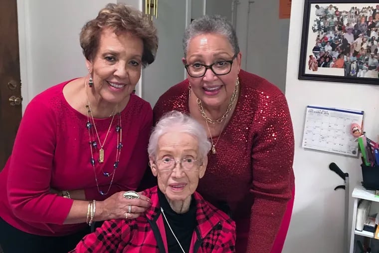 Sisters Joylette Hylick and Katherine Moore flank their mother, Katherine G. Johnson, whose life was the inspiration for the film "Hidden Figures."