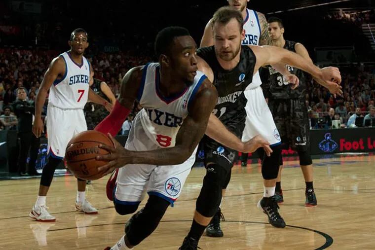 Tony Wroten duels for the ball in front Bilbao Basket's Antanas Kavaliauskas, centre right, during the NBA Global basketball game in Bilbao northern Spain on Sunday, Oct. 6, 2012. (Alvaro Barrientos/AP)