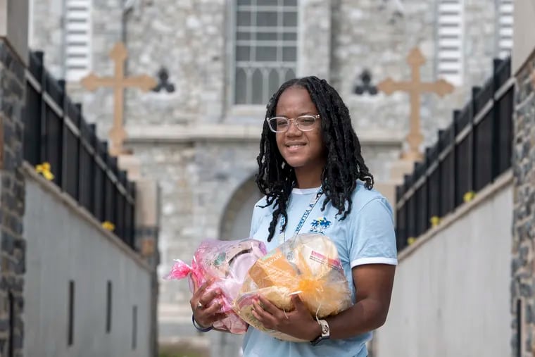 Student Jasmine Mays, holds a COVID good package at Villanova University, where she started a COVID prevention pantry on campus. This is only the latest of many good works she has organized and taken part in on campus and in her community.