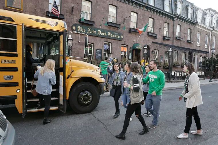 The  Erin Express bus picks people up in front of The New Deck Tavern in 2019.