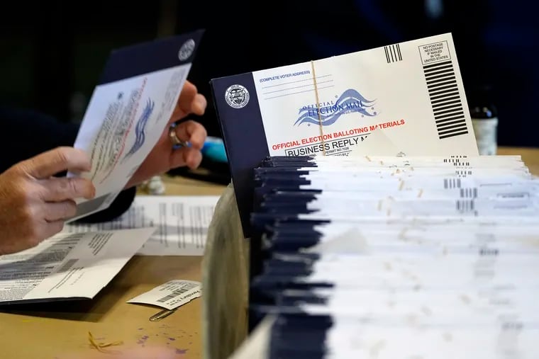 File photo of election workers processing mail-in and absentee ballots for the 2020 general election in Pennsylvania. (AP Photo/Matt Slocum)
