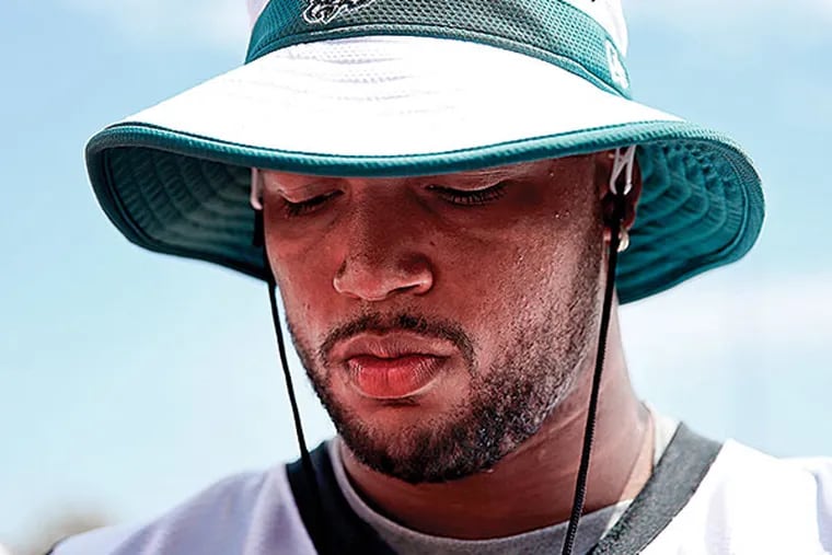 Eagles' Marcus Smith walks off the field after the Eagles Training Camp at the NovaCare Complex in Philadelphia, Pa on August 21, 2015. Smith was injured in yesterday's practice.