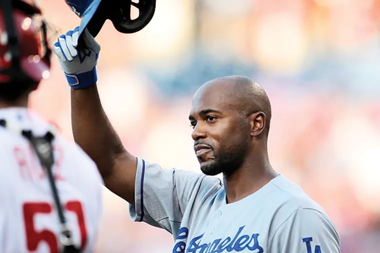 Former Phillie Dodgers' Jimmy Rollins tips his helmet to the fans before his first at-bat during the 1st inning at Citizens Bank Park in Philadelphia, Tuesday, August 4, 2015.