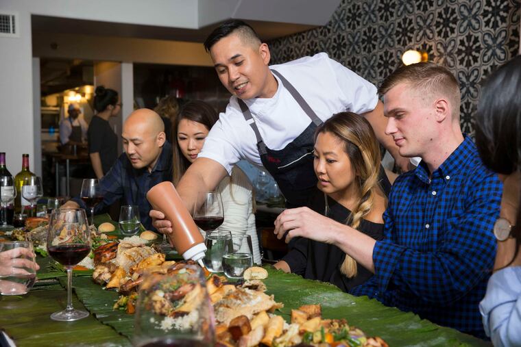 Lou Boquila, chef and owner of Perla, squirts a dash of house banana ketchup at each diner's place for the Sunday meal.