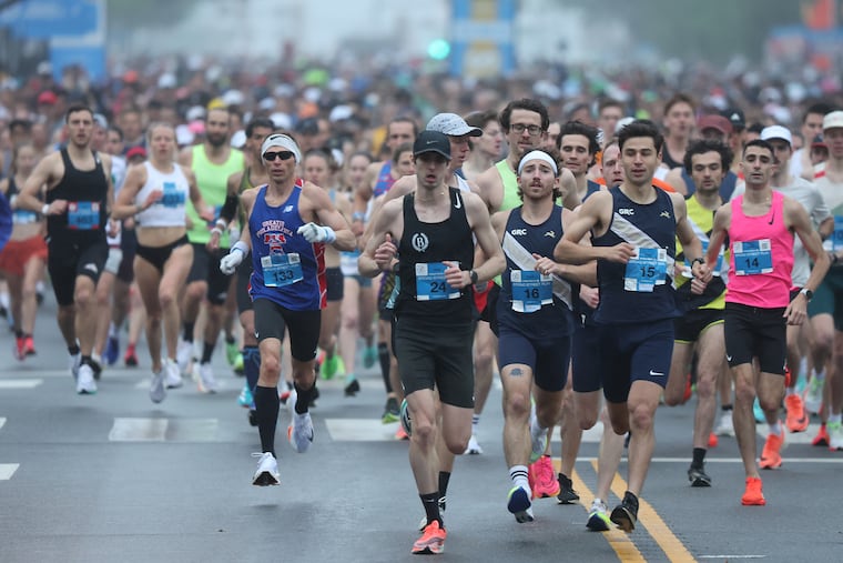 Runners bolt from the starting line during the 2024 Independence Blue Cross Broad Street Run in Philadelphia on May 5. The eventual winner was Kevin McDonnell, of Cherry Hill, N.J. (far right), wearing bib 14.