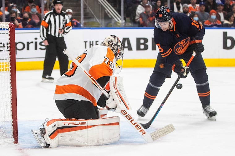 Flyers goalie Carter Hart makes the save on Edmonton Oilers' Zach Hyman during the second period Wednesday. The Flyers won, 5-3, and handed Edmonton its first loss.