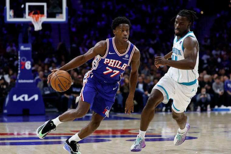 Sixers guard VJ Edgecombe moves upcourt against Hornets guard Sion James on Saturday.