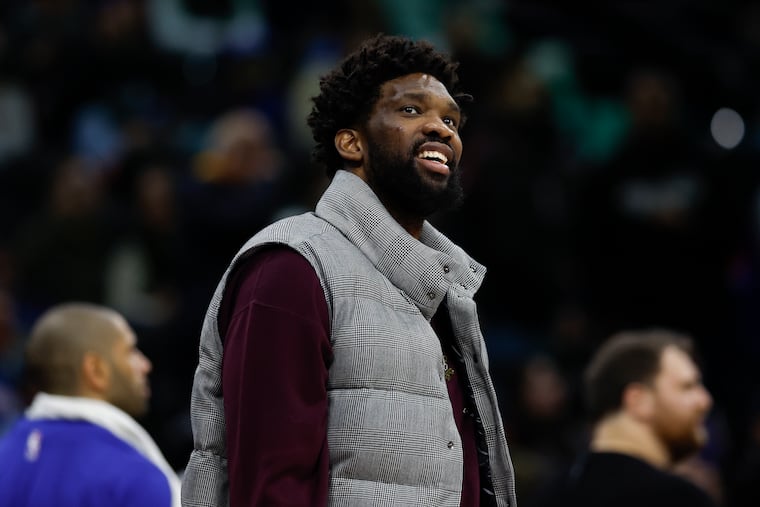 Sixers center Joel Embiid smiles while his teammates played the Sacramento Kings on Friday, January 12, 2024 in Philadelphia.