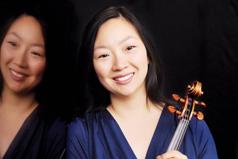 David Kim and Juliette Kang (pictured), concertmaster and first associate concertmaster of the Philadelphia Orchestra, performed Monday at the American Philosophical Society. AMANDA HALL
