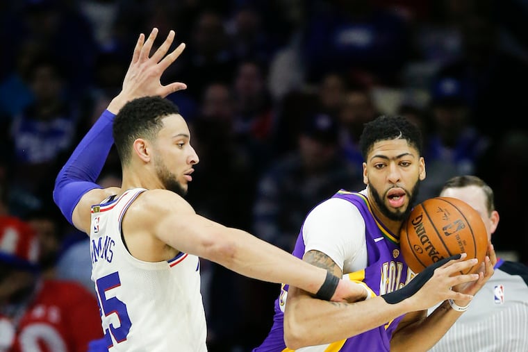 Sixers guard Ben Simmons defends New Orleans Pelicans forward Anthony Davis last season.