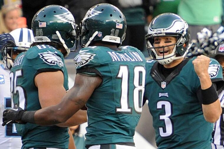 Eagles quarterback Mark Sanchez (right) and Jeremy Maclin (18)
congratulate tight end James Casey. (Clem Murray/Staff Photographer)