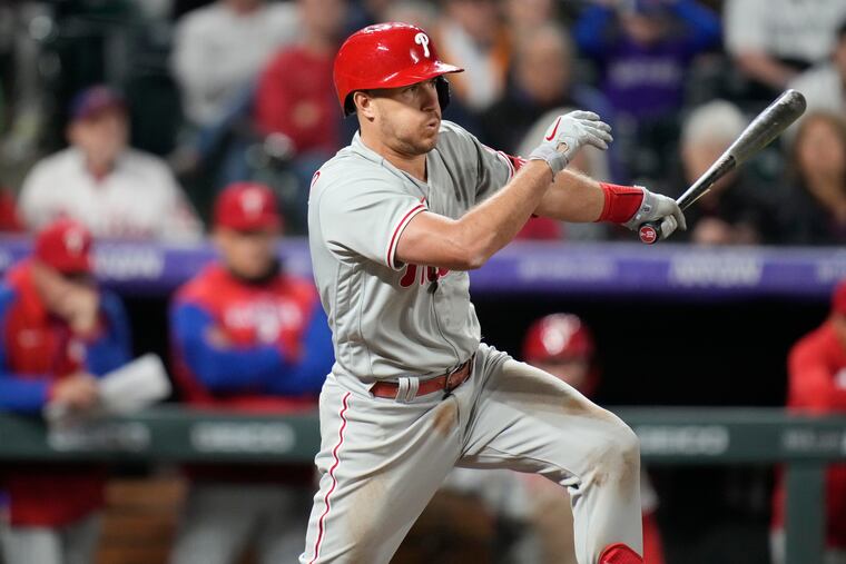 Phillies catcher J.T. Realmuto lines into a double play against Colorado's Jhoulys Chacin on Monday.