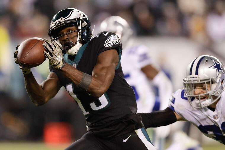 Eagles wide receiver Nelson Agholor makes a catch in front of Dallas' Jeff Heath on Nov. 11.