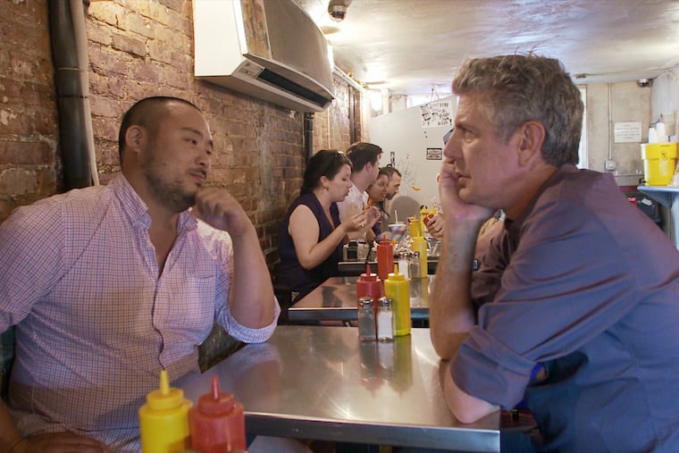 David Chang (left) and Anthony Bourdain sharing a moment in Morgan Neville's documentary, "Roadrunner."