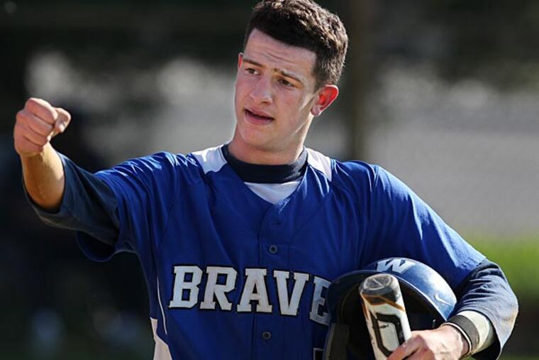 Williamstown's Dan Musilli gets a fist pump after scoring a run in the fifth inning. (Michael Bryant/Staff Photographer)