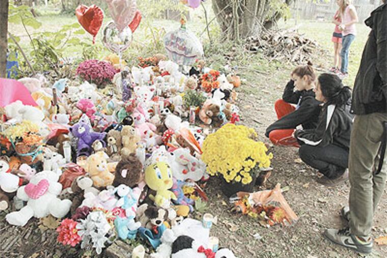 Flowers, balloons, and stuffed animals accumulate at a memorial for Autumn Pasquale, 12, whose body was found Monday in Clayton, Gloucester County. A day after her family accused authorities of bungling the search for the girl, Prosecutor Sean Dalton met with her parents. (Elizabeth Robertson / Staff Photographer)