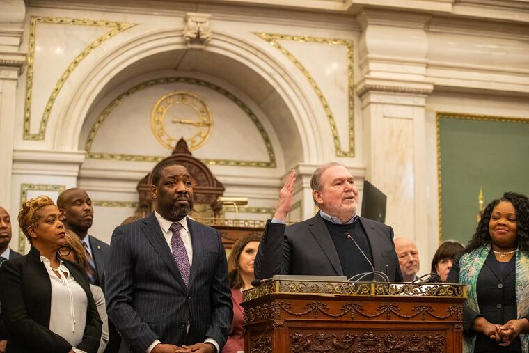 Tax Reform Commission co-chair Richard Vague (center right) speaks at a news conference alongside City Council President Kenyatta Johnson (center left).
