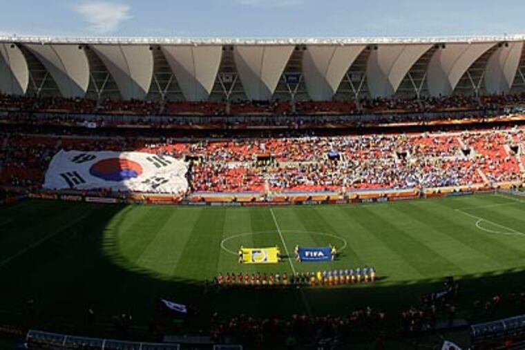 Thousands of seats were empty at the South Korea-Greece game in Port Elizabeth. (Thanassis Stavrakis/AP)
