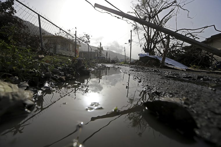 Downed power lines and debris in Yabucoa, Puerto Rico, in the aftermath of Hurricane Maria.
