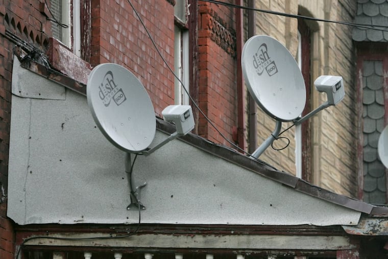 Satellite dishes in North Philadelphia. Can you be poor and have one?