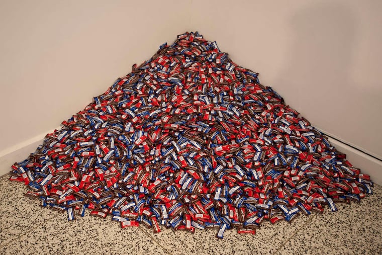"do it" exhibition at Moore College of Art & Design is a 180-pound pile of Peanut Chews, deposited in a corner per instructions from the late American artist Felix Gonzalez-Torres. (RON TARVER / Staff Photographer)