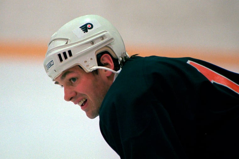 Dale Hawerchuk, a forward with the Flyers, takes a rest during practice at the Coliseum in Voorhees, N.J., in 1996.