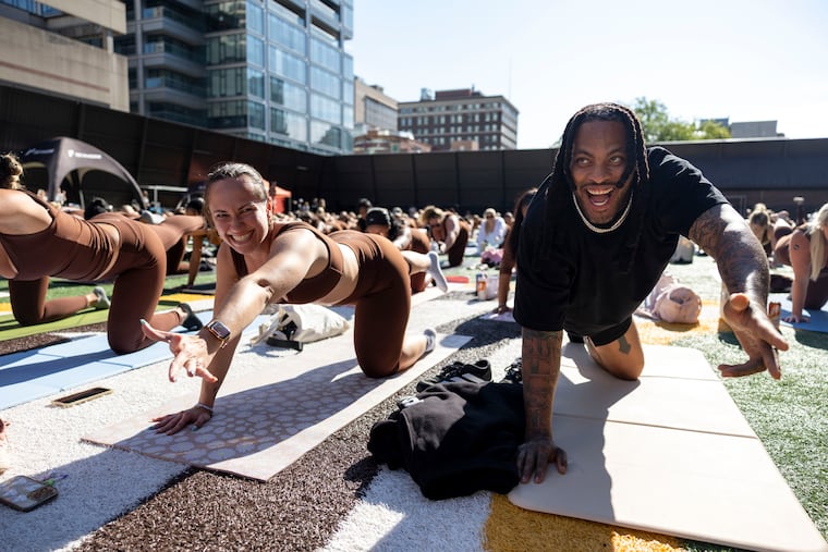 Gabriella Ward, of Rittenhouse, (left) and Waka Flocka Flame participate in Sweat & Sculpt, led by influencer Jacklyn Romano at the Friends Select School on Saturday, Aug. 29, 2026, in Philadelphia.