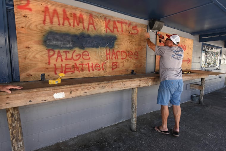 Rob Quinn boards up Lagerheads Tavern in Wrightsville Beach, N.C. as they prepare for Hurricane Florence.
