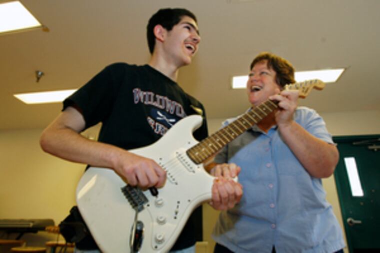 Teacher Janice Delozier helps Joey Martino, 17, in a music class at Bancroft. Bancroft is back on its feet after several years of financial and legal hardships.